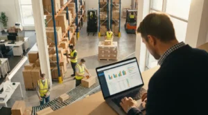 Operations manager monitoring customer orders while warehouse staff prepare shipments